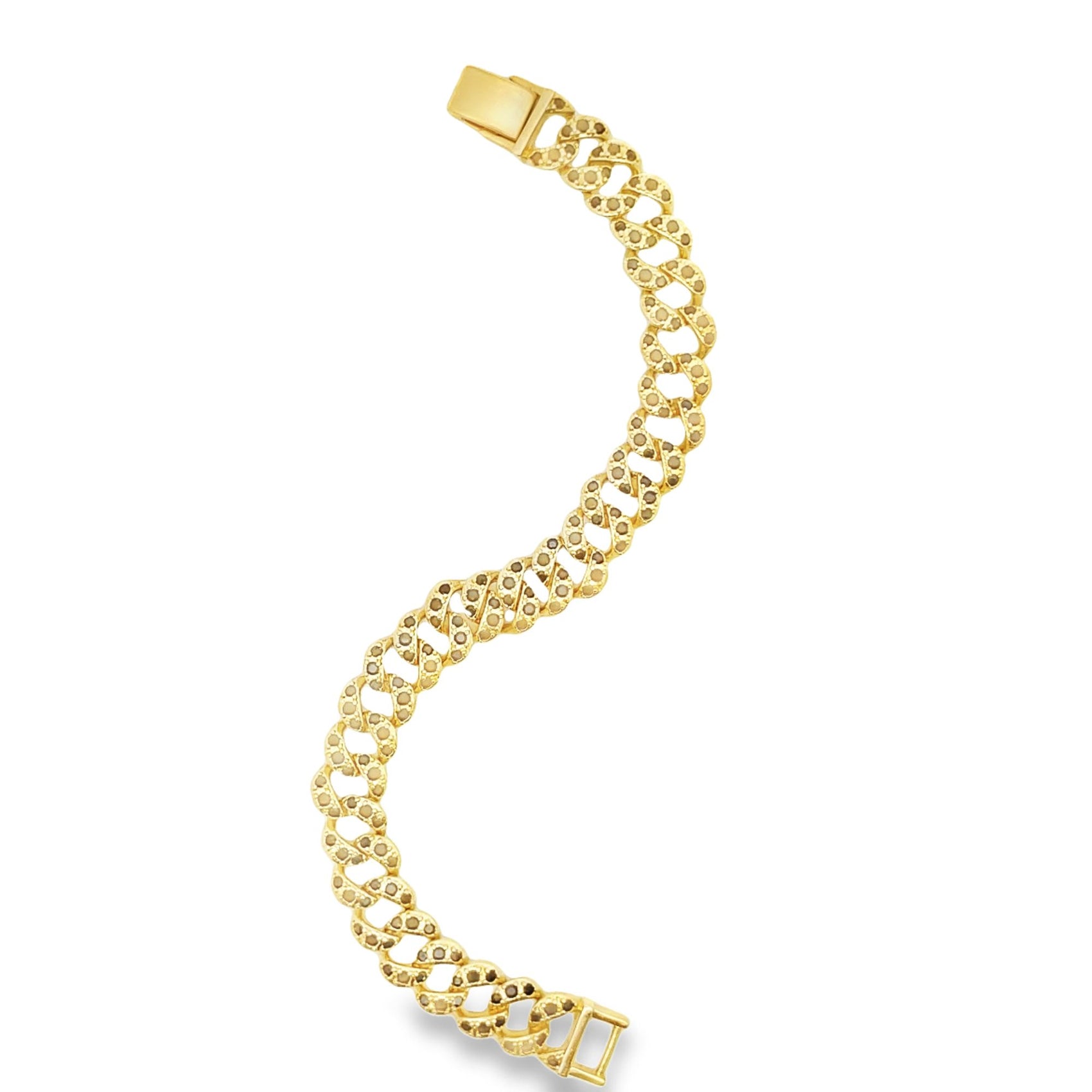 A curved gold cuban link bracelet studded with small black diamonds glistens against a plain white background.