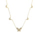A delicate gold butterfly station necklace features sparkling pavé-set crystals along its chain against a clean white background.