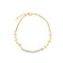 A delicate gold chain bracelet features dainty flower charms along its length against a plain white background.