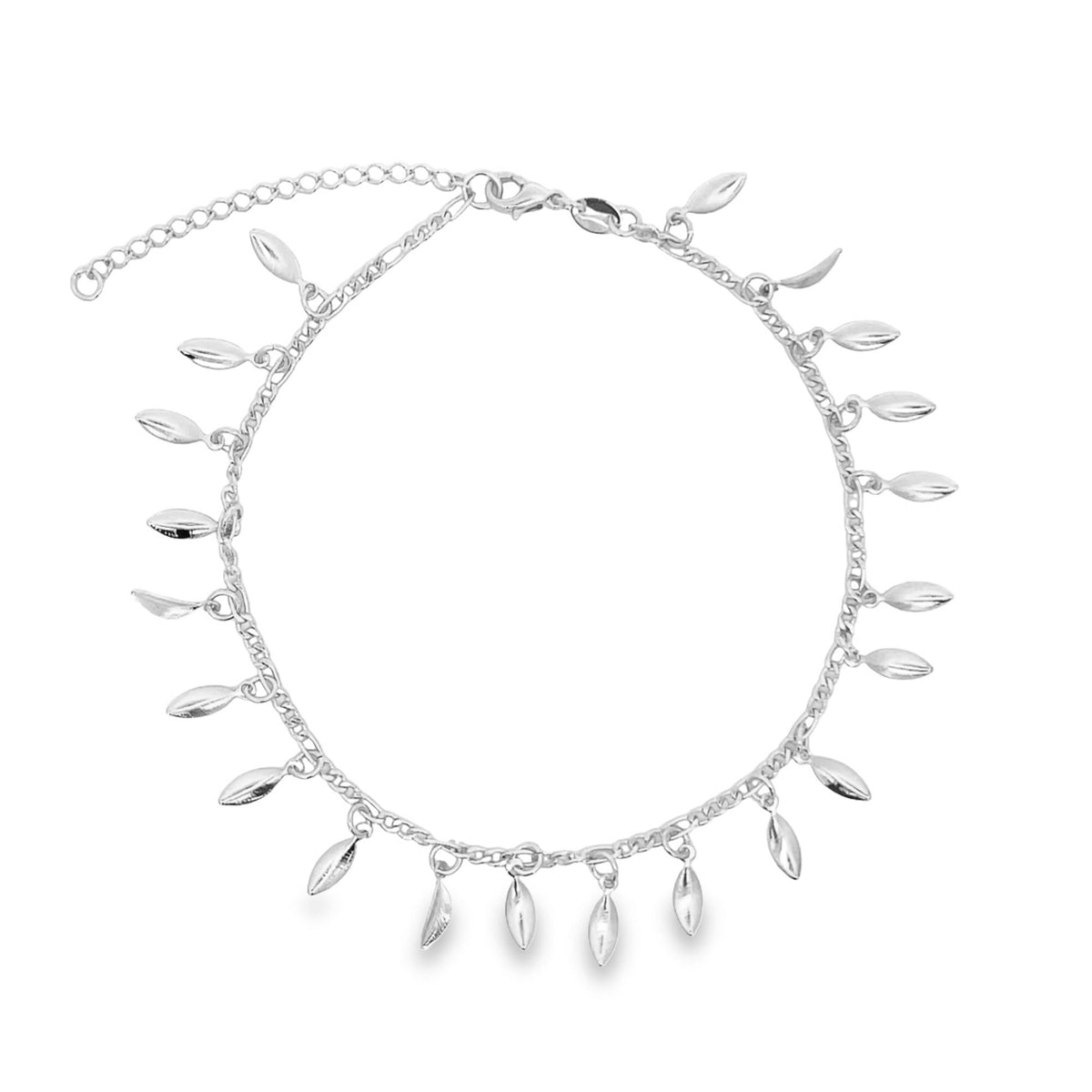A delicate silver anklet adorned with dangling leaf charms rests in a circle on a white background.