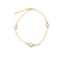A delicate gold chain bracelet features three bezel-set round diamond charms displayed against a clean white background.