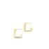 A pair of geometric gold huggie hoop earrings rests against a clean white background.