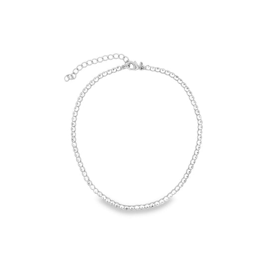A sparkling silver tennis necklace rests gracefully on a clean white background.