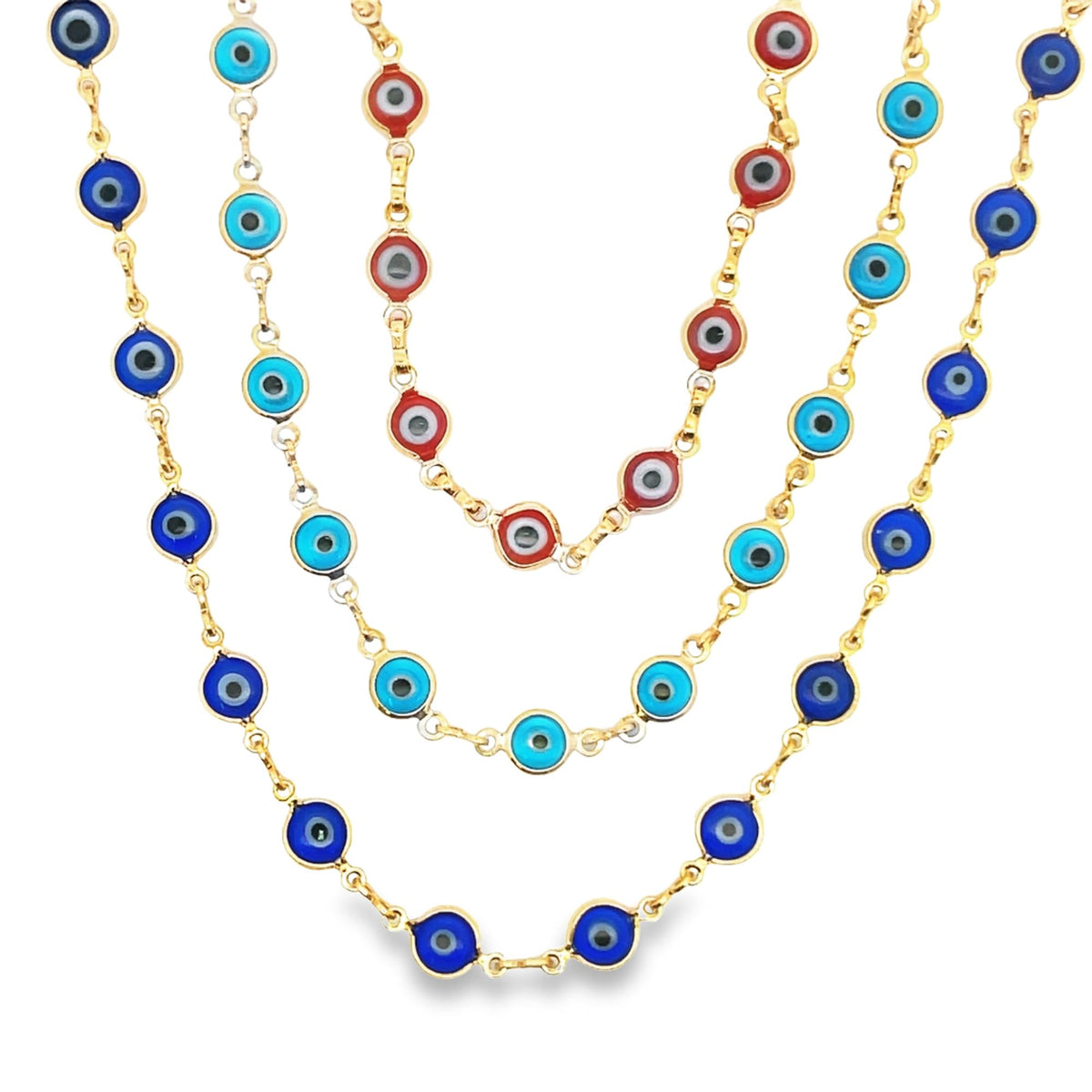 Three gold chains feature blue and red evil eye charms against a white background.