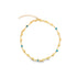 A gold anklet features alternating heart charms and blue evil eye beads against a white background.