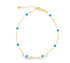 A delicate gold chain bracelet features alternating enamel evil eye charms and small gold bars against a white background.