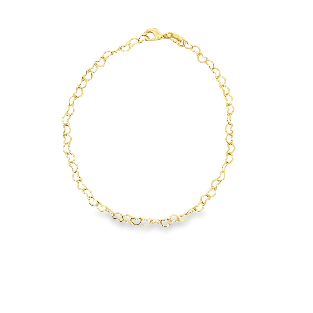 A delicate gold chain necklace made of interlocking heart links rests on a plain white background.
