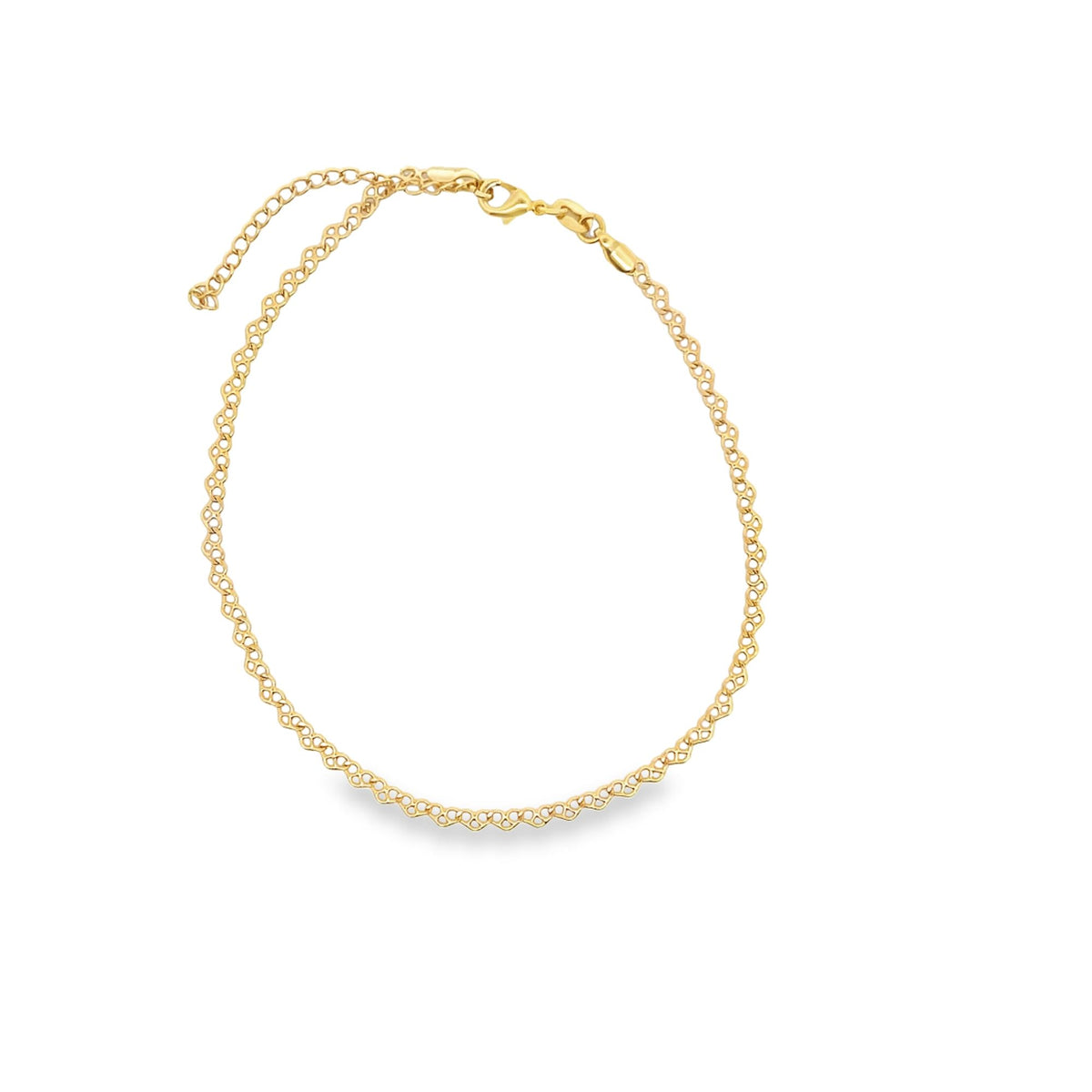 A delicate gold chain necklace with an intricate interlocking link pattern rests on a white background.