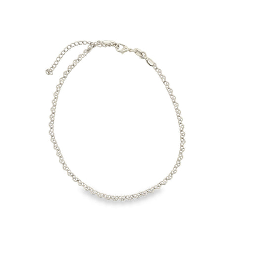 A delicate silver chain necklace rests on a plain white background, showcasing its intricate interlocking links and secure lobster clasp.