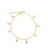 A delicate gold chain anklet dangles with several small star charms against a clean white background.