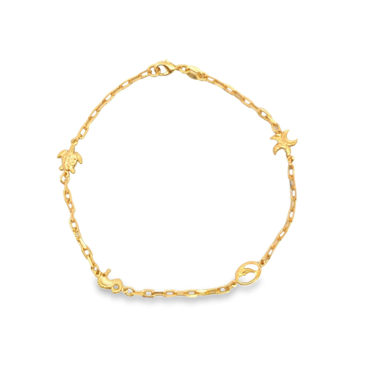 A delicate gold chain bracelet features charming marine charms, including a sea turtle, starfish, seahorse, and dolphin, displayed against a clean white background.