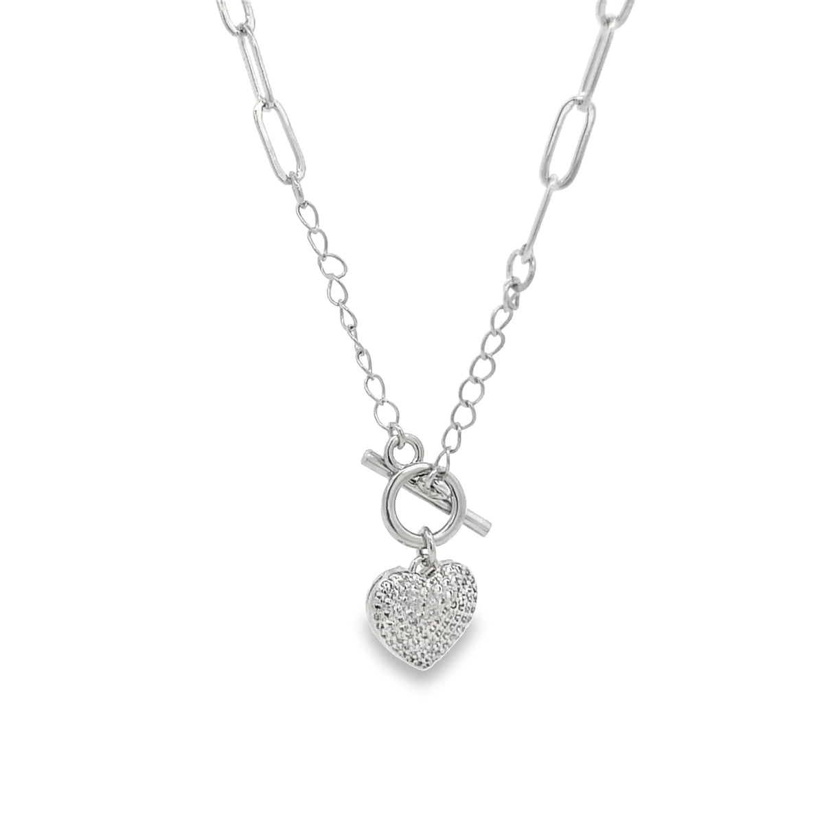 A silver paperclip chain necklace features a pavé-set diamond heart pendant hanging from a toggle clasp.