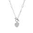 A silver paperclip chain necklace features a pavé-set diamond heart pendant hanging from a toggle clasp.
