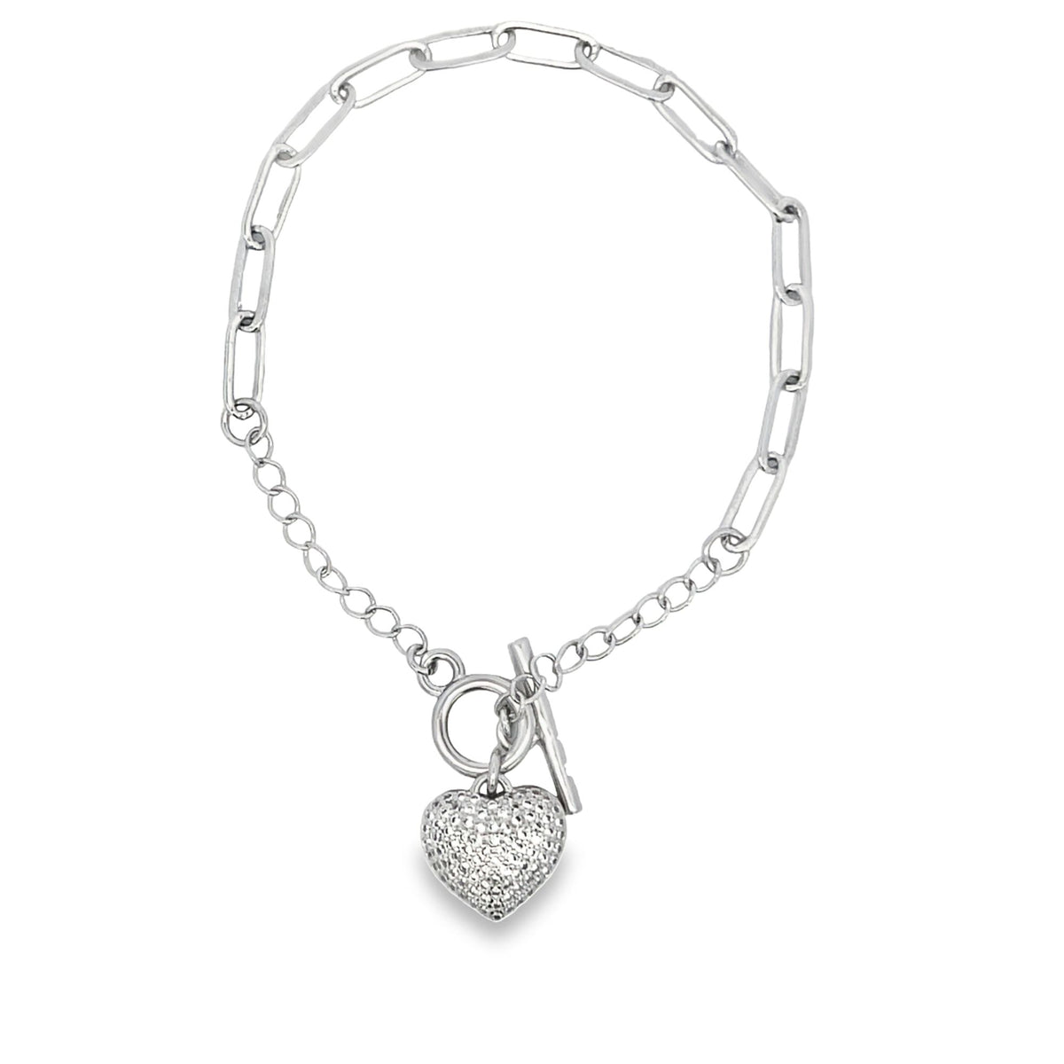 A silver toggle bracelet features a pave diamond heart charm hanging from a mixed paperclip and cable chain.