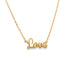 A delicate gold chain necklace displays the word "Love" in cursive script as its pendant.