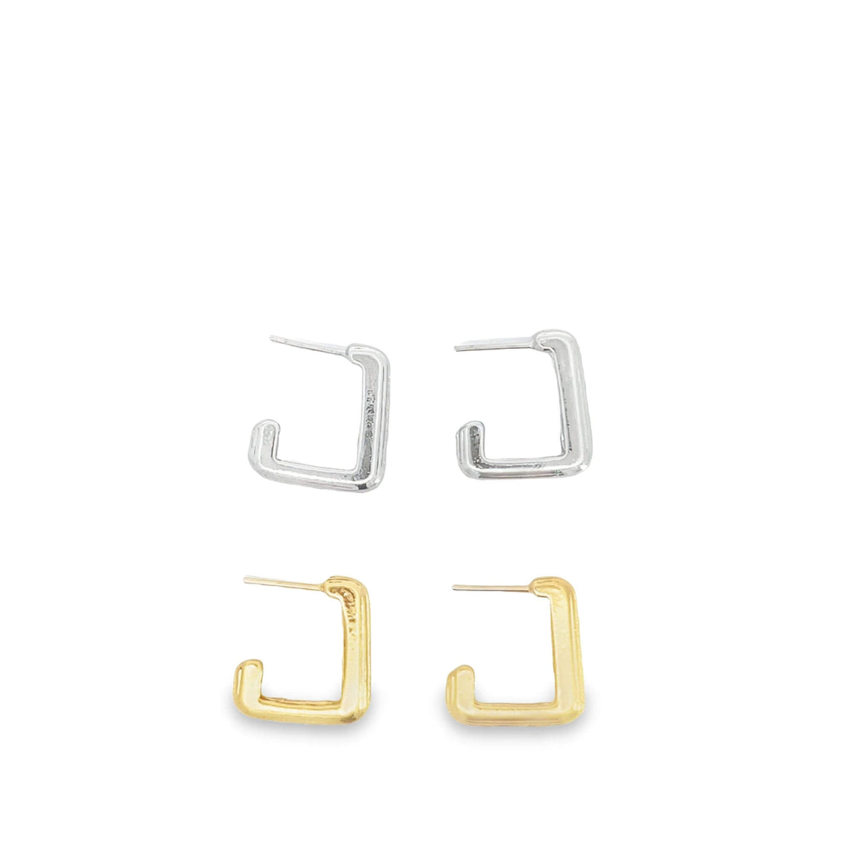 Two pairs of small, square hoop earrings in silver and gold rest on a white surface.