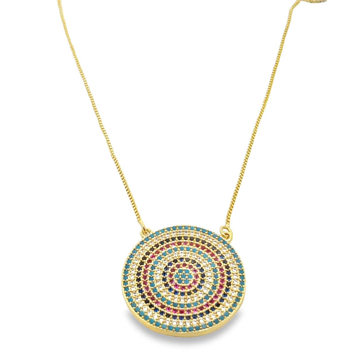 A delicate gold chain holds a round pendant intricately paved with concentric circles of multicolored cubic zirconia stones.