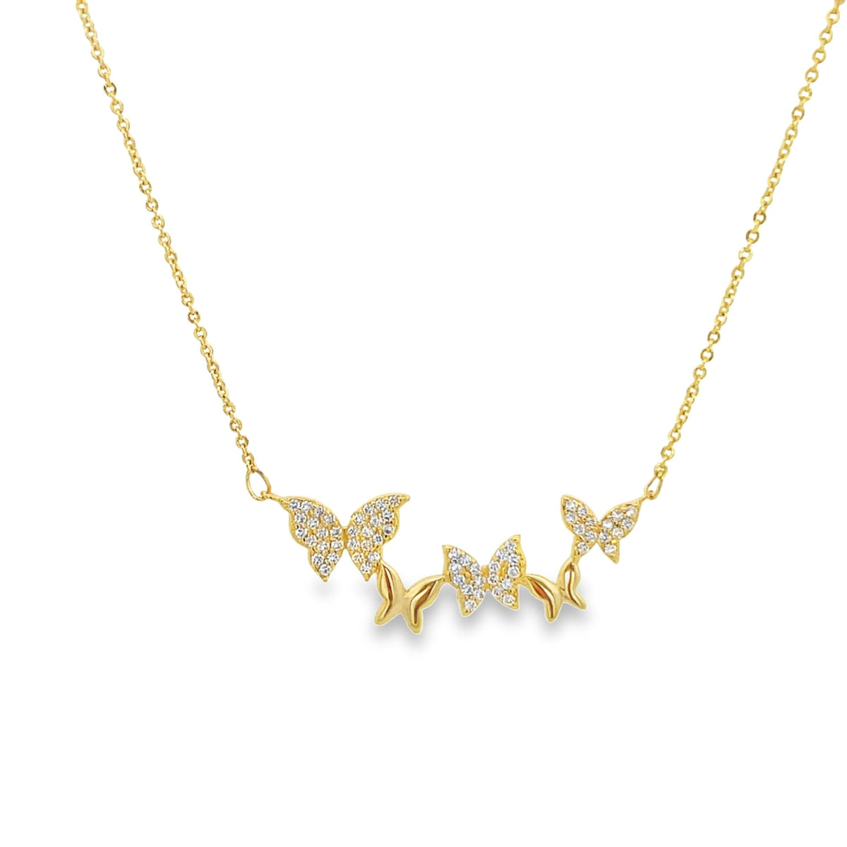 A delicate gold chain necklace features a cluster of sparkling diamond-encrusted butterfly pendants.