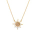 A delicate gold chain necklace features a radiant sunburst pendant accented with sparkling diamonds and a smooth center stone.