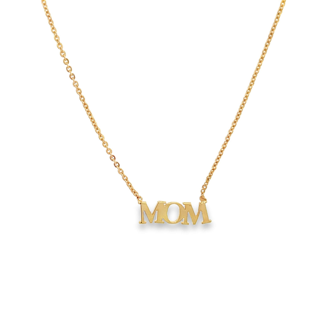 A delicate gold chain necklace dangles gracefully against a plain white background, featuring a polished letter pendant that spells the word MOM.