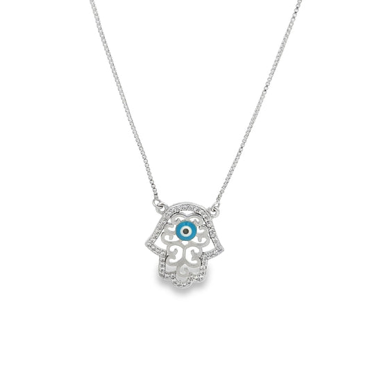 A silver Hamsa hand necklace features a sparkling pave-set diamond border and a central blue evil eye charm on a delicate box chain.