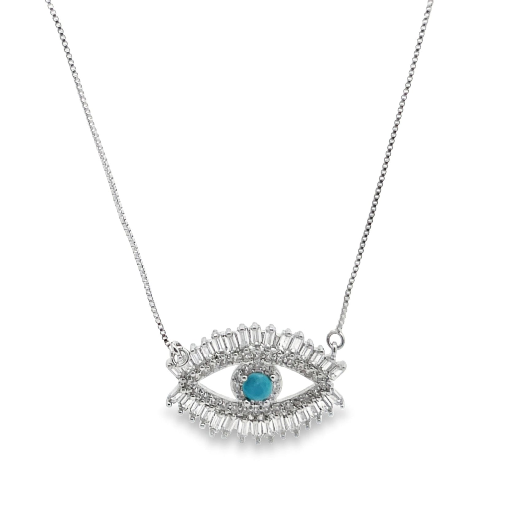 A delicate silver evil eye necklace features a vibrant turquoise gemstone center surrounded by sparkling baguette and pavé crystals.