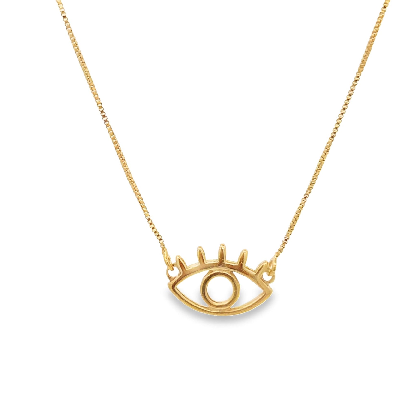 A delicate gold chain holds a charming evil eye pendant against a clean white background.