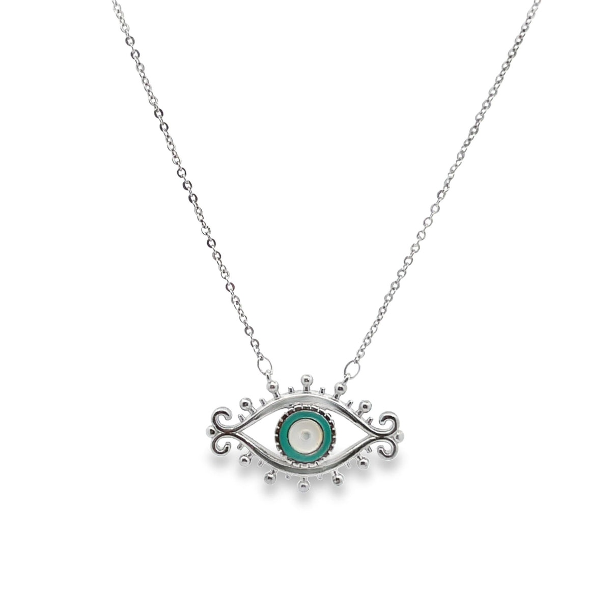 A delicate silver necklace features an ornate evil eye pendant with vibrant turquoise and white enamel details against a white background.