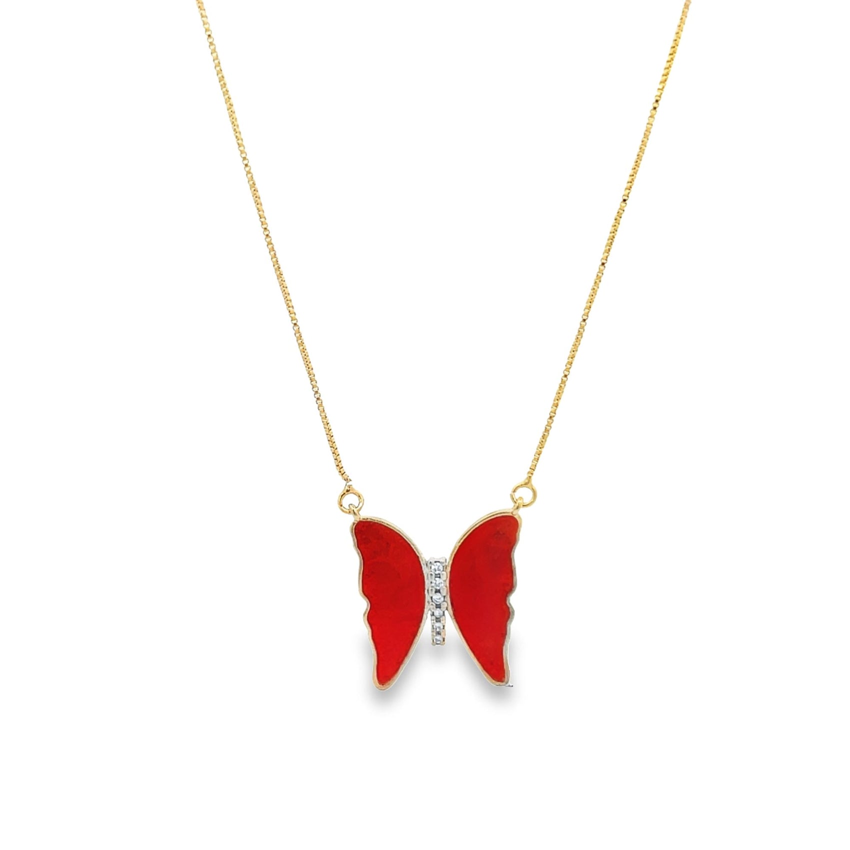 A delicate gold chain necklace features a vibrant red enamel butterfly pendant accented with sparkling diamonds.