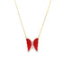 A delicate gold chain necklace features a vibrant red enamel butterfly pendant accented with sparkling diamonds.