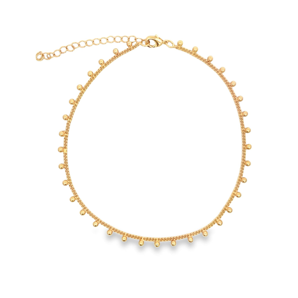 A delicate gold choker necklace features a delicate chain adorned with evenly spaced round bead charms.