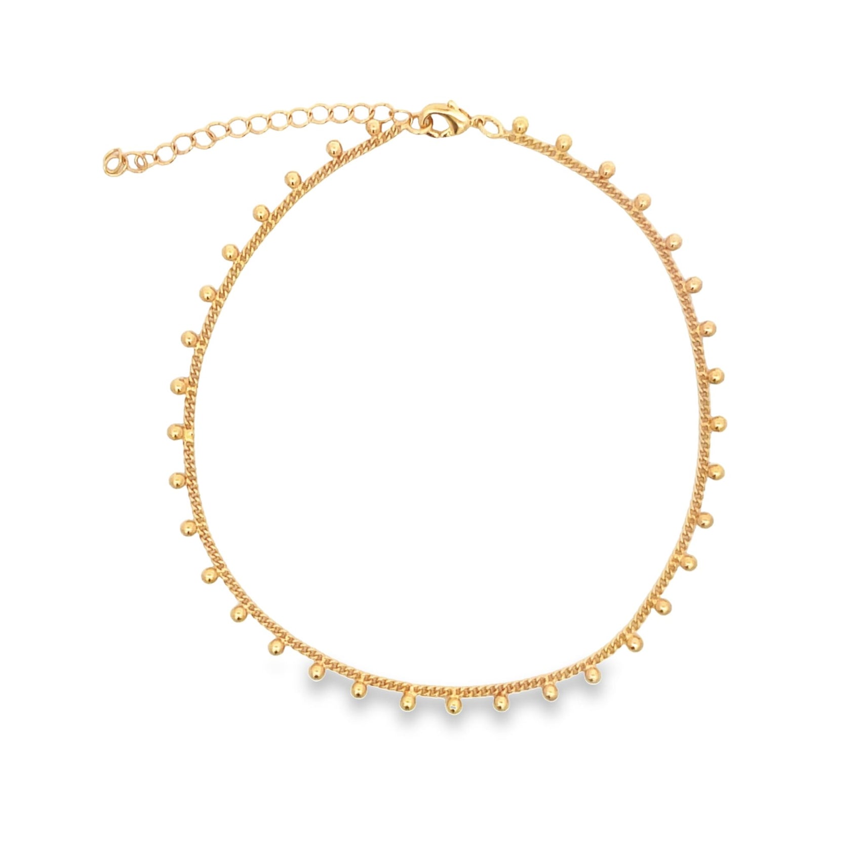 A delicate gold choker necklace features a delicate chain adorned with evenly spaced round bead charms.