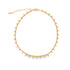 A delicate gold choker necklace features a delicate chain adorned with evenly spaced round bead charms.