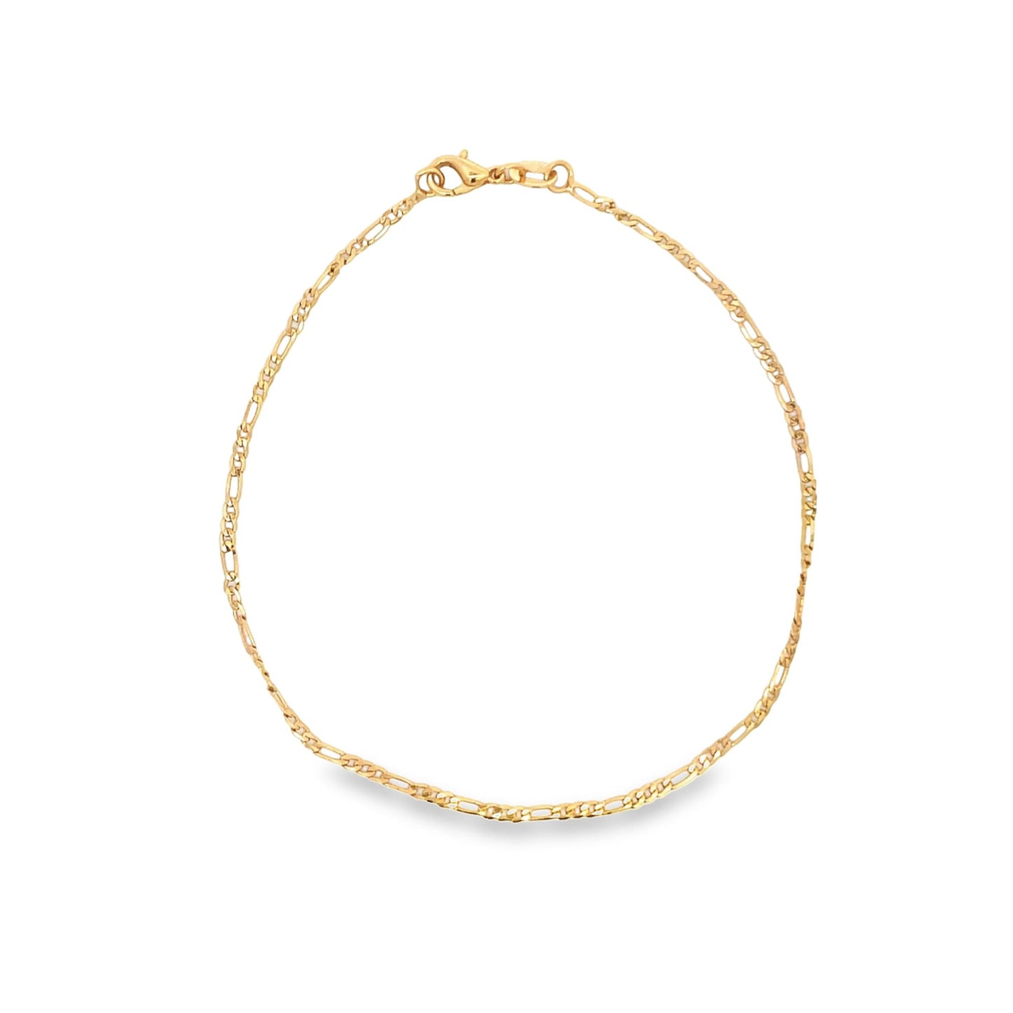 A delicate gold Figaro chain anklet rests in a circle against a white background, featuring a secure lobster claw clasp at the top.