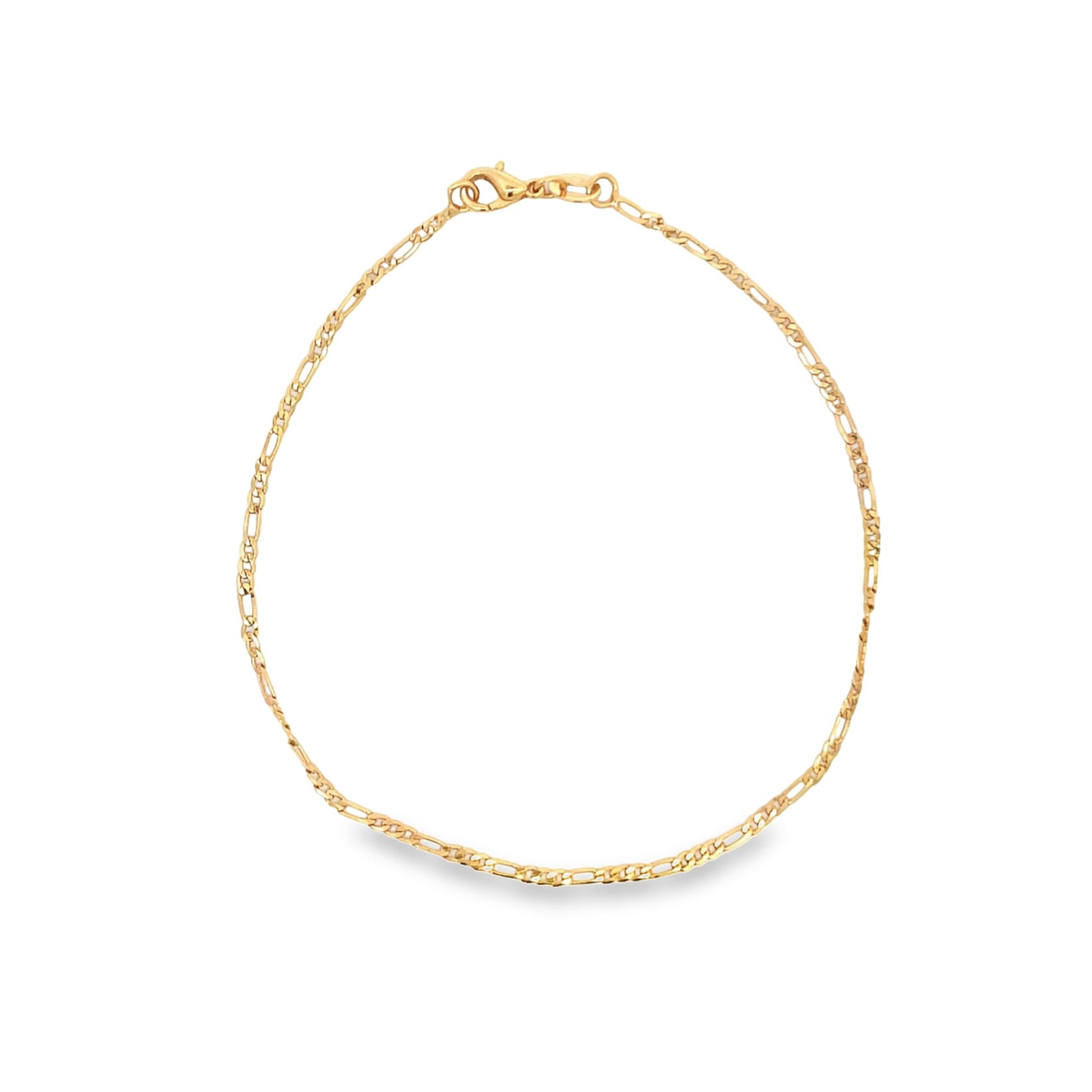 A delicate gold Figaro chain anklet rests in a circle against a white background, featuring a secure lobster claw clasp at the top.