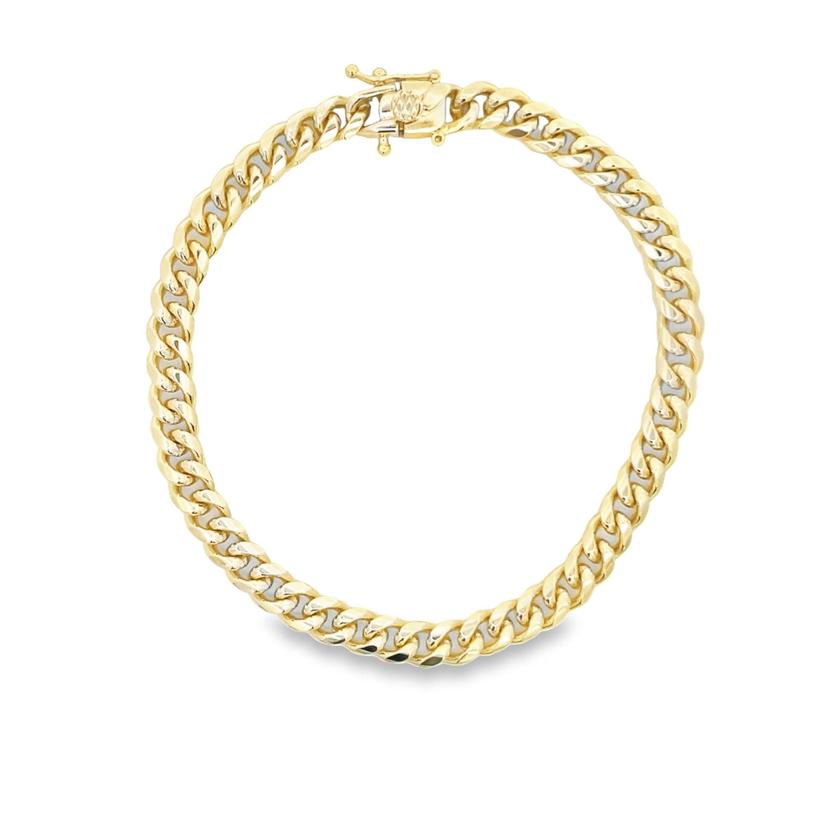 A polished yellow gold Miami Cuban link chain bracelet rests in a circle against a clean white background, showcasing its intricate interlocking links and secure box clasp.