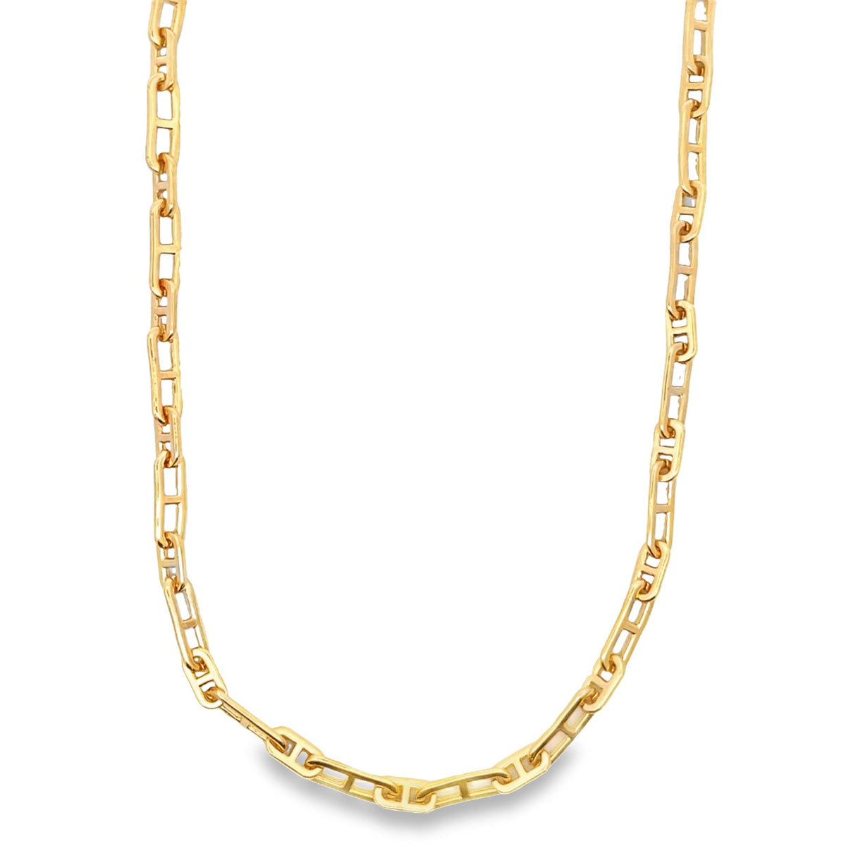 A polished yellow gold anchor chain necklace drapes in a smooth curve against a clean white background.