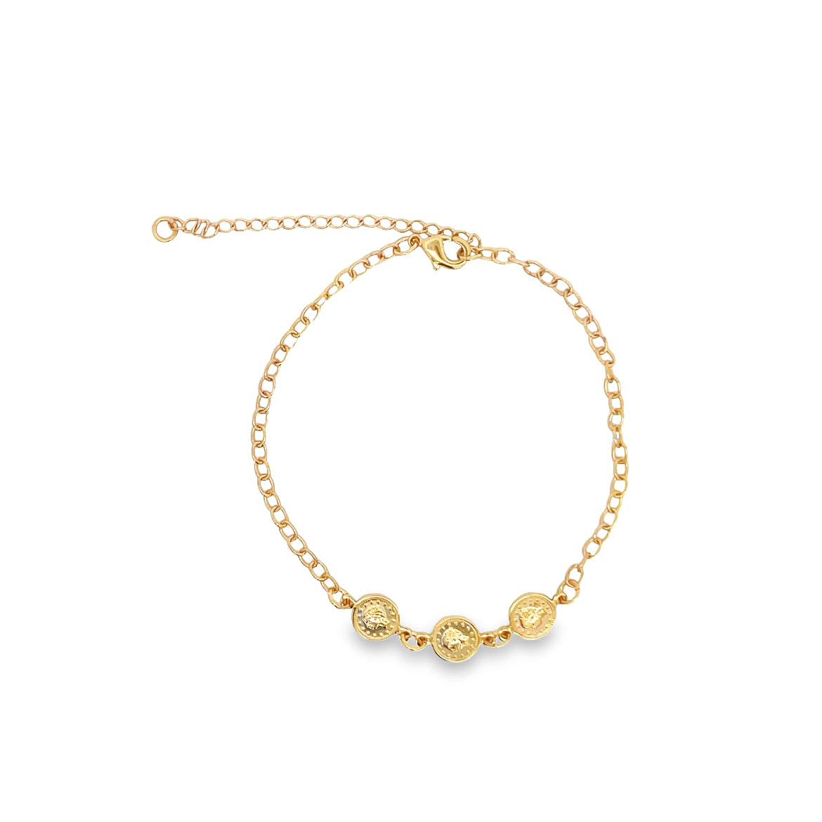 A delicate gold chain bracelet features three small coin charms dangling along the bottom against a plain white background.
