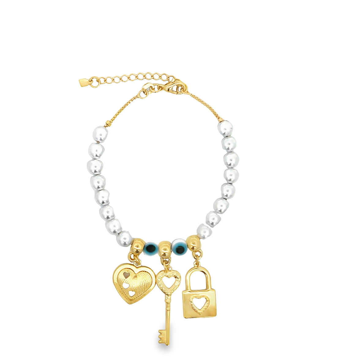 A gold charm bracelet features a strand of white beads accented with evil eye beads and dangling gold heart, key, and lock charms.