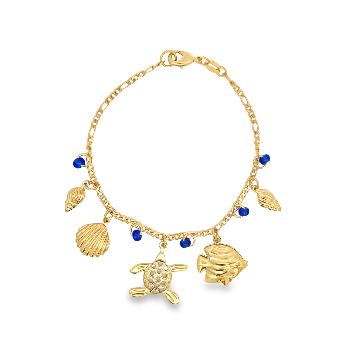 A gold charm bracelet features dangling sea life charms, including a turtle and fish, accented with blue beads against a white background.