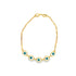 A delicate gold chain bracelet features five blue and white evil eye charms.