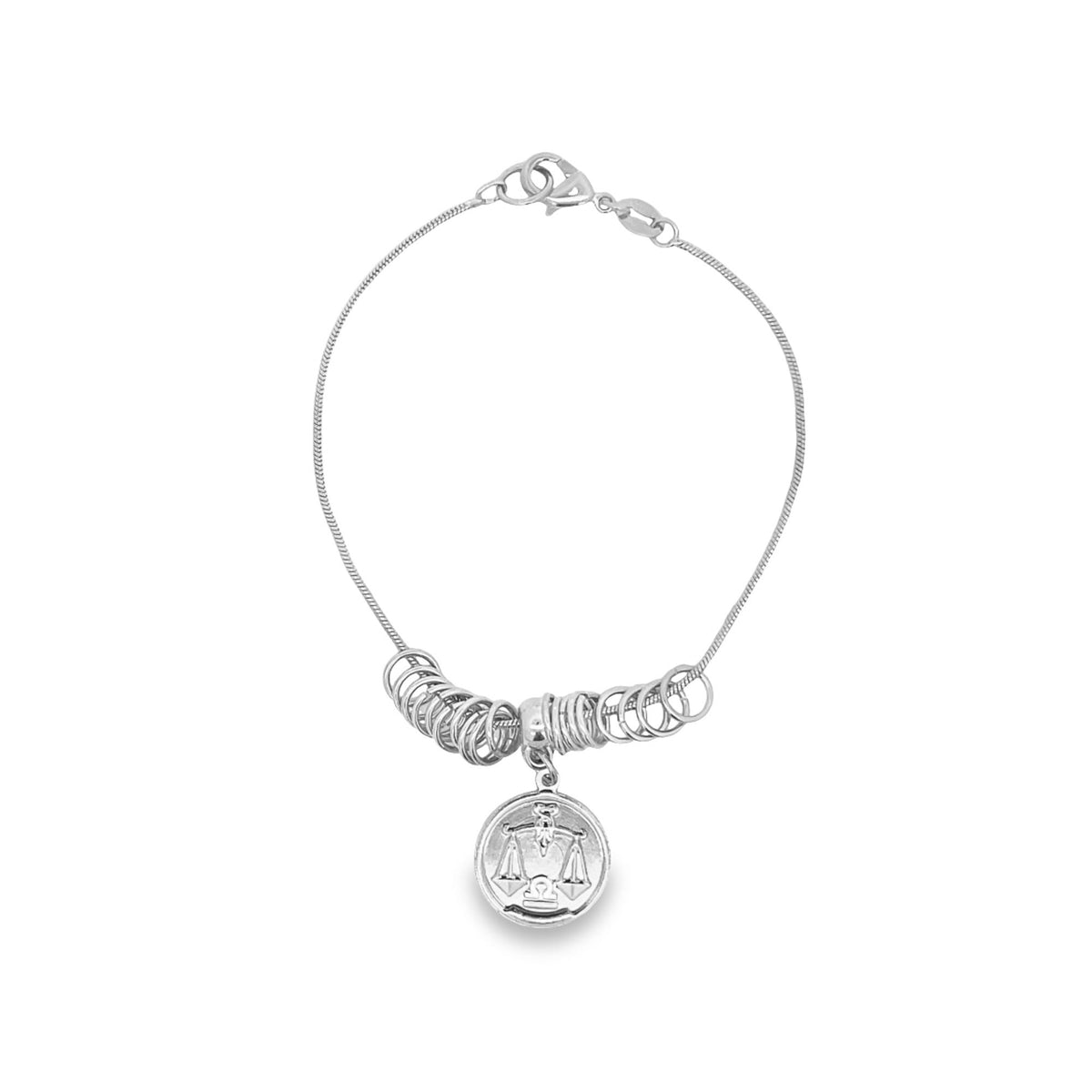 A silver Libra zodiac charm bracelet features multiple hanging rings along a delicate chain against a clean white background.
