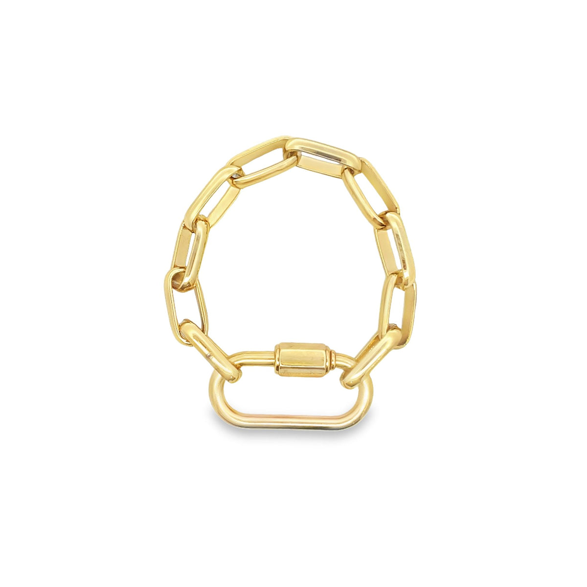 A gold chain ring features a unique interlocking link design with a small rectangular clasp pendant.