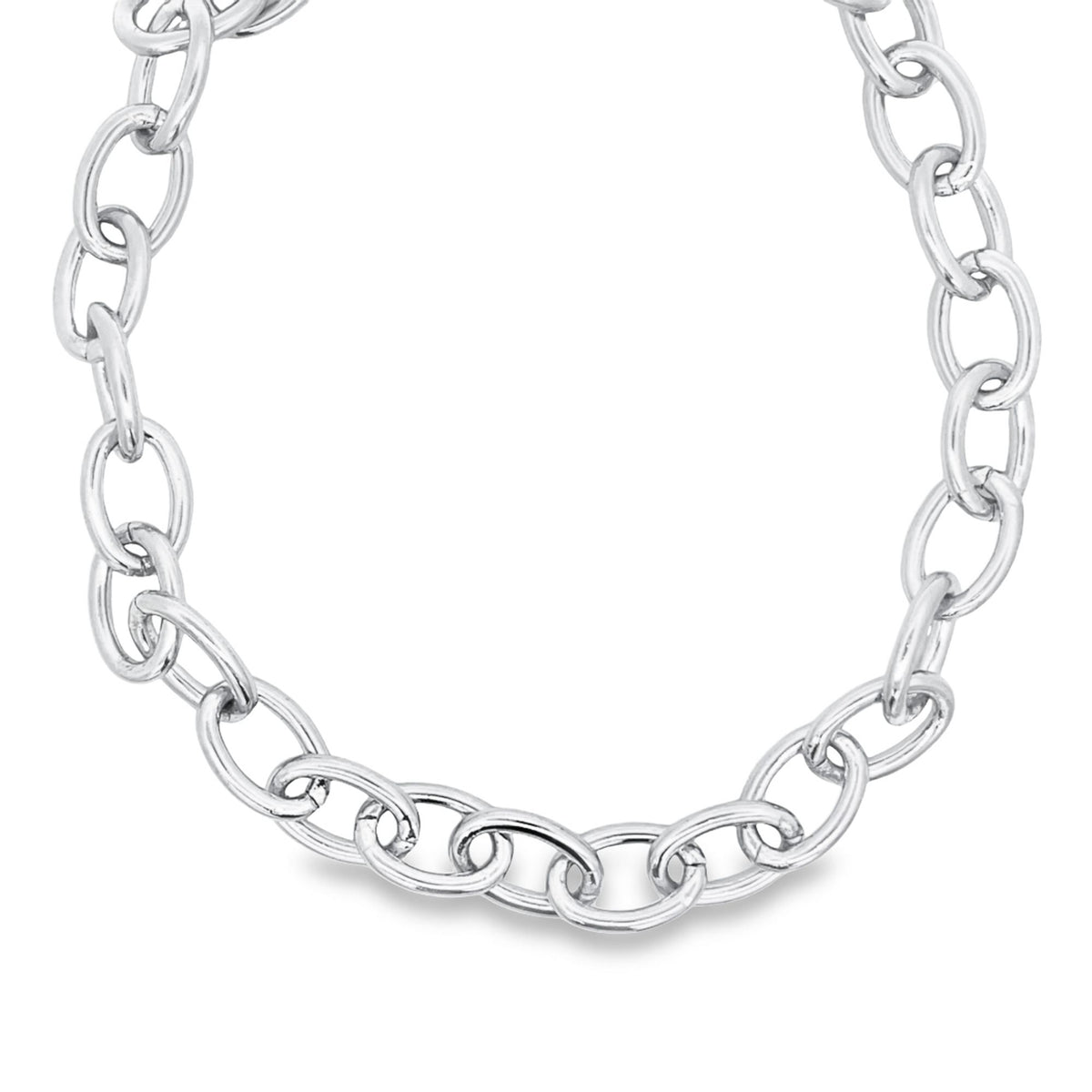 A polished silver link chain necklace curves gracefully against a clean white background.