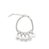 A silver mesh charm bracelet displays hanging symbols including a cross, evil eye, hamsa hand, four-leaf clover, and heart.