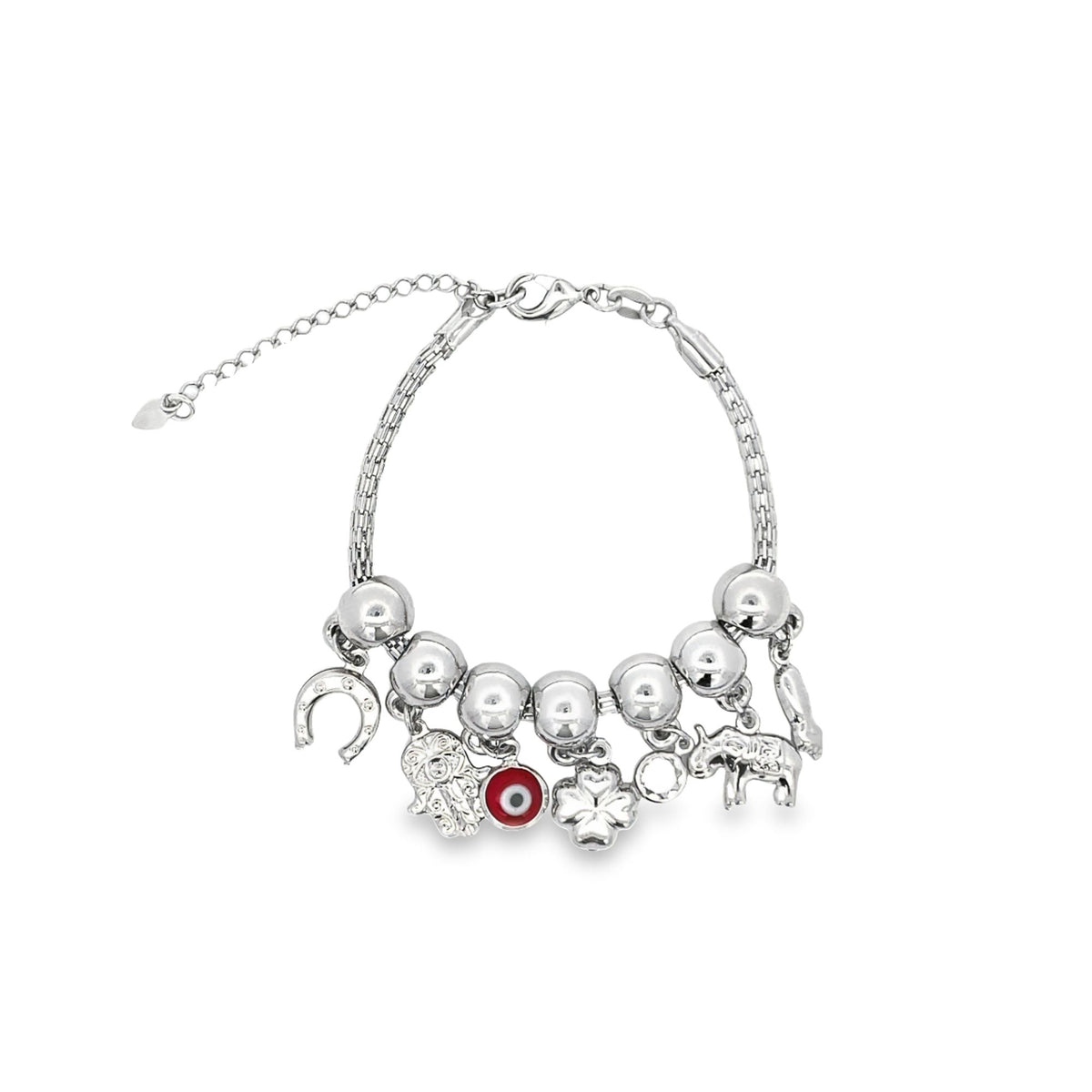 A silver charm bracelet features dangling symbols including a horseshoe, Hamsa hand, red evil eye, clover, and elephant against a white background.