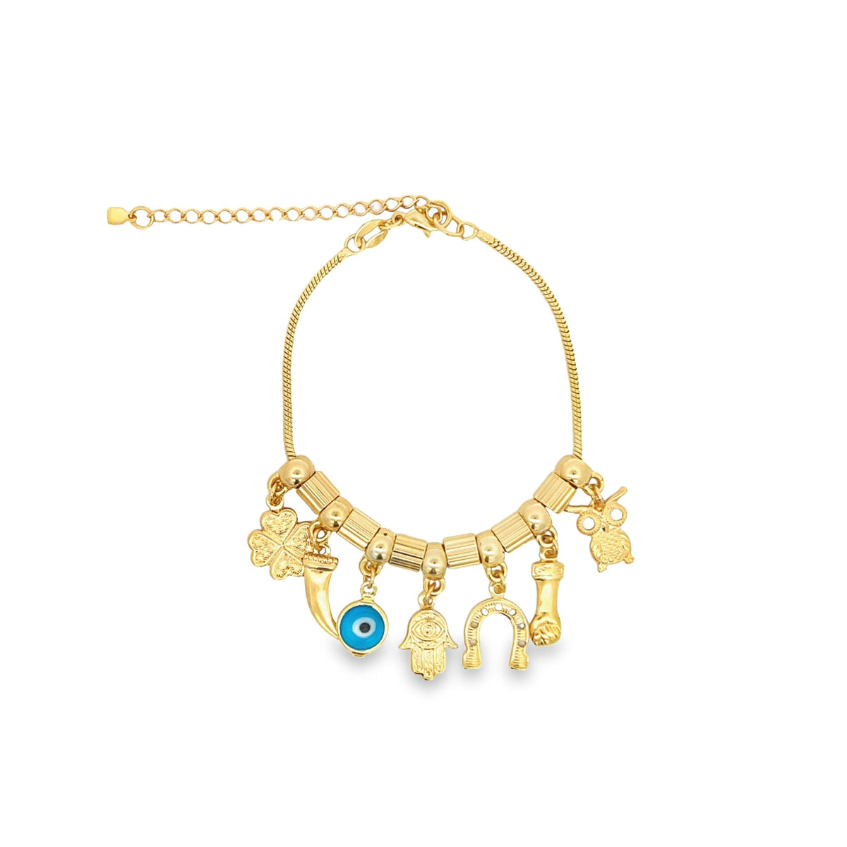 A gold charm bracelet features lucky symbols including an evil eye, hamsa hand, horseshoe, and four-leaf clover against a white background.