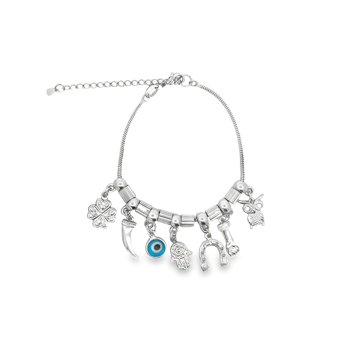 A silver charm bracelet features dangling good luck symbols including an evil eye, a hamsa hand, a horseshoe, and a four-leaf clover against a white background.