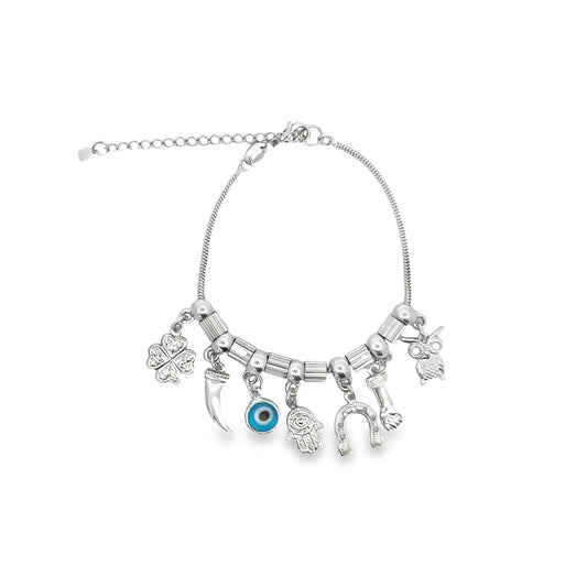 A silver charm bracelet features dangling good luck symbols including an evil eye, a hamsa hand, a horseshoe, and a four-leaf clover against a white background.