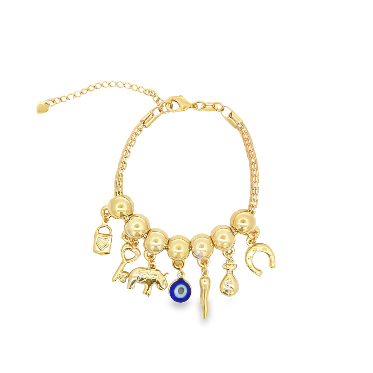 A gold charm bracelet features various dangling lucky charms, including an evil eye, an elephant, a key, and a horseshoe.